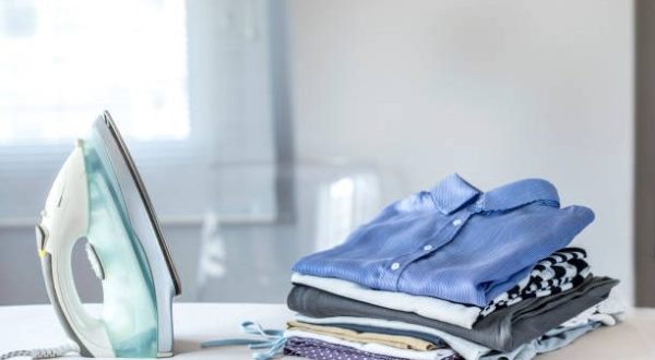 Ironing clothes on ironing board